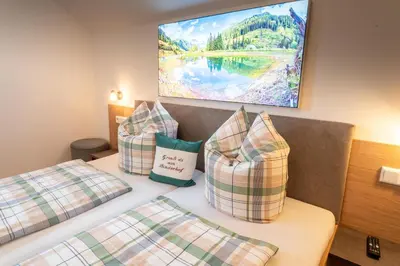 Ein Bett oder Betten in einem Zimmer der Unterkunft Binderhof