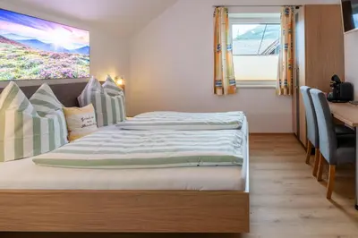 Ein Bett oder Betten in einem Zimmer der Unterkunft Binderhof
