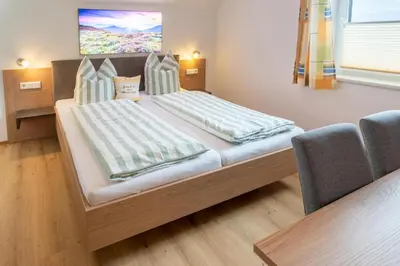 Ein Bett oder Betten in einem Zimmer der Unterkunft Binderhof