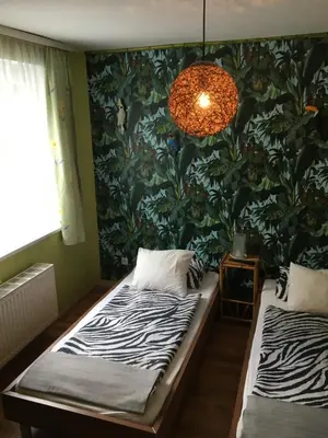 Ein Bett oder Betten in einem Zimmer der Unterkunft Gasthaus Zum Stadtwald