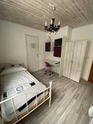 Ein Bett oder Betten in einem Zimmer der Unterkunft Gasthaus Zum Stadtwald