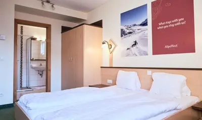 Ein Bett oder Betten in einem Zimmer der Unterkunft Hotel Kirchboden by Alpeffect Hotels