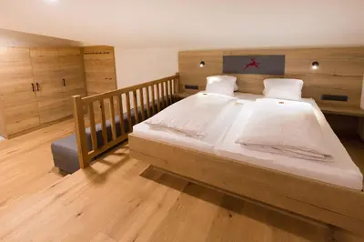 Ein Bett oder Betten in einem Zimmer der Unterkunft Hotel Rosner
