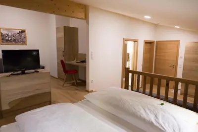 Ein Bett oder Betten in einem Zimmer der Unterkunft Hotel Rosner