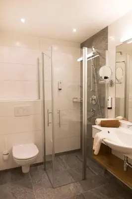 Ein Badezimmer in der Unterkunft Hotel Rosner