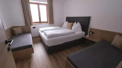 Ein Bett oder Betten in einem Zimmer der Unterkunft Apartmenthaus Kristall