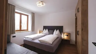 Ein Bett oder Betten in einem Zimmer der Unterkunft Apartmenthaus Kristall