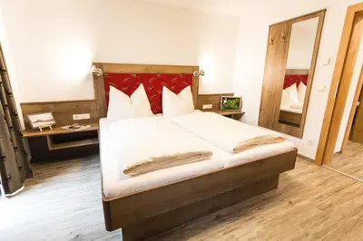 Ein Bett oder Betten in einem Zimmer der Unterkunft Pension Schönberger