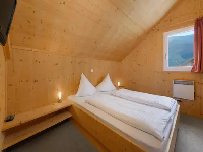 Ein Bett oder Betten in einem Zimmer der Unterkunft Holzchalet nahe Skilift Hohentauern