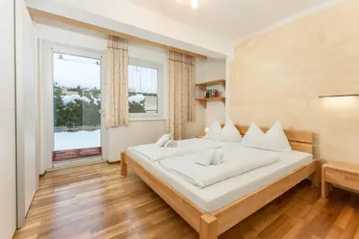 Ein Bett oder Betten in einem Zimmer der Unterkunft Ferienwohnungen Karoline by Schladming-Appartements
