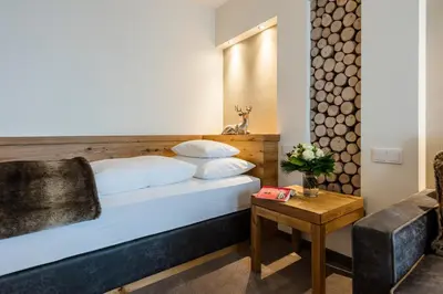 Ein Bett oder Betten in einem Zimmer der Unterkunft Superior Hotel Panorama