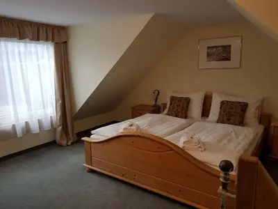Ein Bett oder Betten in einem Zimmer der Unterkunft Hotel Tauplitzerhof