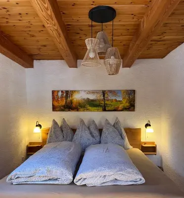 Ein Bett oder Betten in einem Zimmer der Unterkunft Umundumhütte