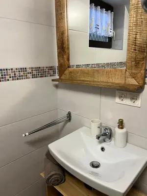 Ein Badezimmer in der Unterkunft Umundumhütte