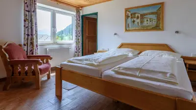 Ein Bett oder Betten in einem Zimmer der Unterkunft Hotel Landhaus Ausswinkl