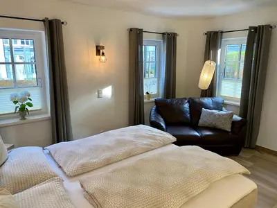 Ein Bett oder Betten in einem Zimmer der Unterkunft Im Kurpark