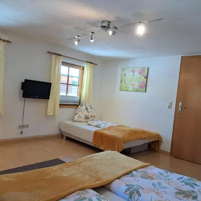 Ein Bett oder Betten in einem Zimmer der Unterkunft Reiters-Ferienhaus