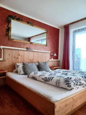 Ein Bett oder Betten in einem Zimmer der Unterkunft Pension Sonnhof