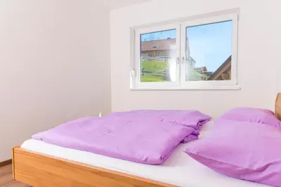 Ein Bett oder Betten in einem Zimmer der Unterkunft Bergblick-Planai - 5 Schlafzimmer plus eigene Sauna