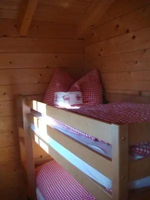 Ein Bett oder Betten in einem Zimmer der Unterkunft Postalm Lodge