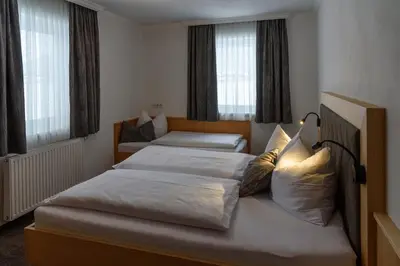 Ein Bett oder Betten in einem Zimmer der Unterkunft Ferienwohnungen Reiter