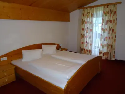 Ein Bett oder Betten in einem Zimmer der Unterkunft Ferienwohnungen Reiter