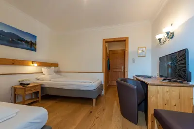 Ein Bett oder Betten in einem Zimmer der Unterkunft Hotel & Restaurant Ragginger Attersee