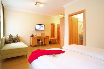Ein Bett oder Betten in einem Zimmer der Unterkunft Hotel & Restaurant Ragginger Attersee