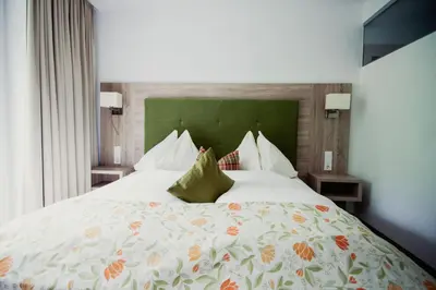 Ein Bett oder Betten in einem Zimmer der Unterkunft Hotel Aberseehof