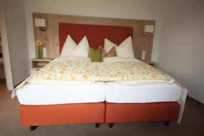 Ein Bett oder Betten in einem Zimmer der Unterkunft Hotel Aberseehof