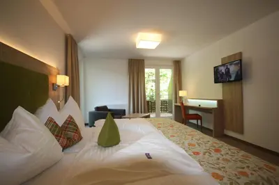 Ein Bett oder Betten in einem Zimmer der Unterkunft Hotel Aberseehof