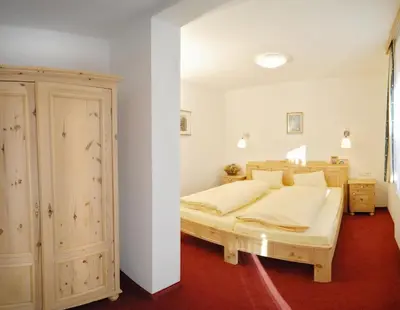 Ein Bett oder Betten in einem Zimmer der Unterkunft Landhotel Kielhuberhof