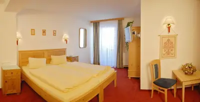 Ein Bett oder Betten in einem Zimmer der Unterkunft Landhotel Kielhuberhof