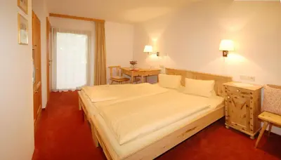 Ein Bett oder Betten in einem Zimmer der Unterkunft Landhotel Kielhuberhof