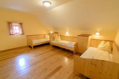 Ein Bett oder Betten in einem Zimmer der Unterkunft JUFA Hotel Donnersbachwald