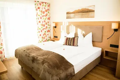 Ein Bett oder Betten in einem Zimmer der Unterkunft Frühstückspension Huber