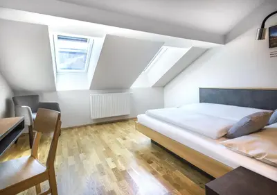 Ein Bett oder Betten in einem Zimmer der Unterkunft JUFA Hotel Schladming