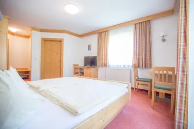 Ein Bett oder Betten in einem Zimmer der Unterkunft Appartementhaus Elmo Viehhauser KG