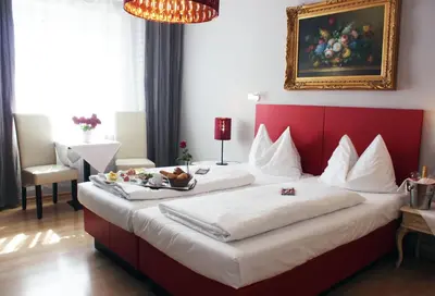Ein Bett oder Betten in einem Zimmer der Unterkunft Stadthotel Restaurant Auerhahn
