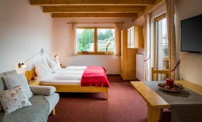 Ein Bett oder Betten in einem Zimmer der Unterkunft Appartementhaus Speckalm