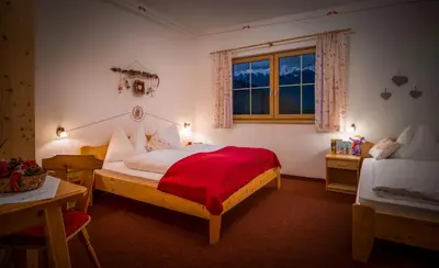 Ein Bett oder Betten in einem Zimmer der Unterkunft Appartementhaus Speckalm