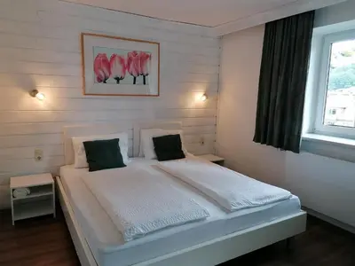 Ein Bett oder Betten in einem Zimmer der Unterkunft Steakhouse Fieg