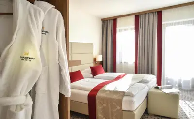 Ein Bett oder Betten in einem Zimmer der Unterkunft Hotel Brückenwirt
