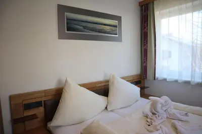 Ein Bett oder Betten in einem Zimmer der Unterkunft Jasmin