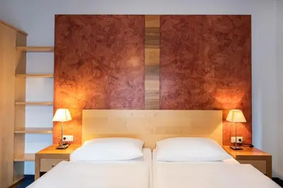 Ein Bett oder Betten in einem Zimmer der Unterkunft Parkhotel zur Klause