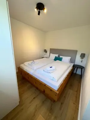 Ein Bett oder Betten in einem Zimmer der Unterkunft Kesselgrubs Apartements Ski & Badeglück