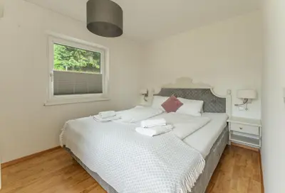 Ein Bett oder Betten in einem Zimmer der Unterkunft Kesselgrubs Apartements Ski & Badeglück