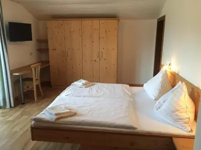 Ein Bett oder Betten in einem Zimmer der Unterkunft Gasthof Tennenblick