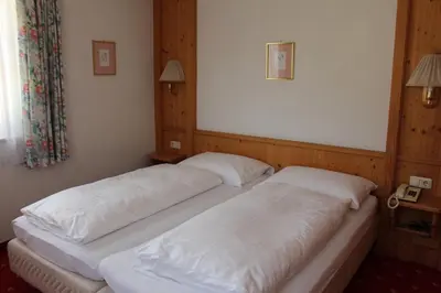 Ein Bett oder Betten in einem Zimmer der Unterkunft Hotel Grafenwirt