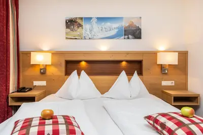 Ein Bett oder Betten in einem Zimmer der Unterkunft Hotel Pongauerhof